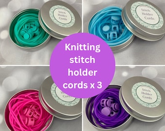 May include: Three round metal tins with lids, each containing a coiled length of colorful elastic cord and small plastic stitch holders. The lids have a label that reads "Stitch Holder Cords".
