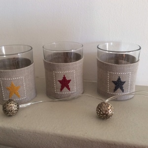 Embroidered sleeve for candle or photophore