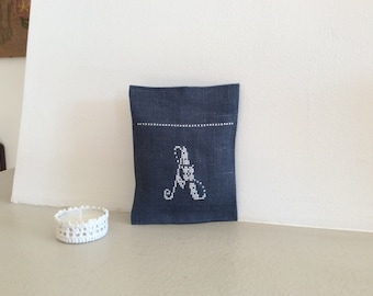 Small cushion filled with wadding and lavender with cross-stitch embroidery