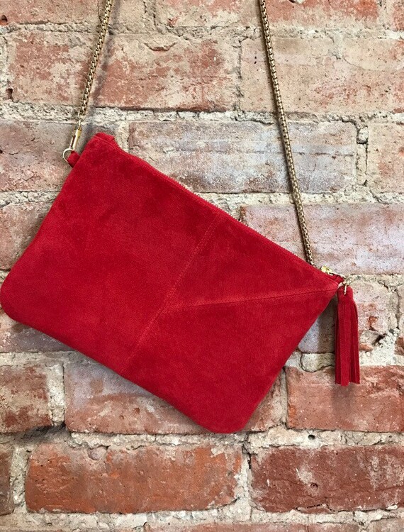 red suede clutch bag