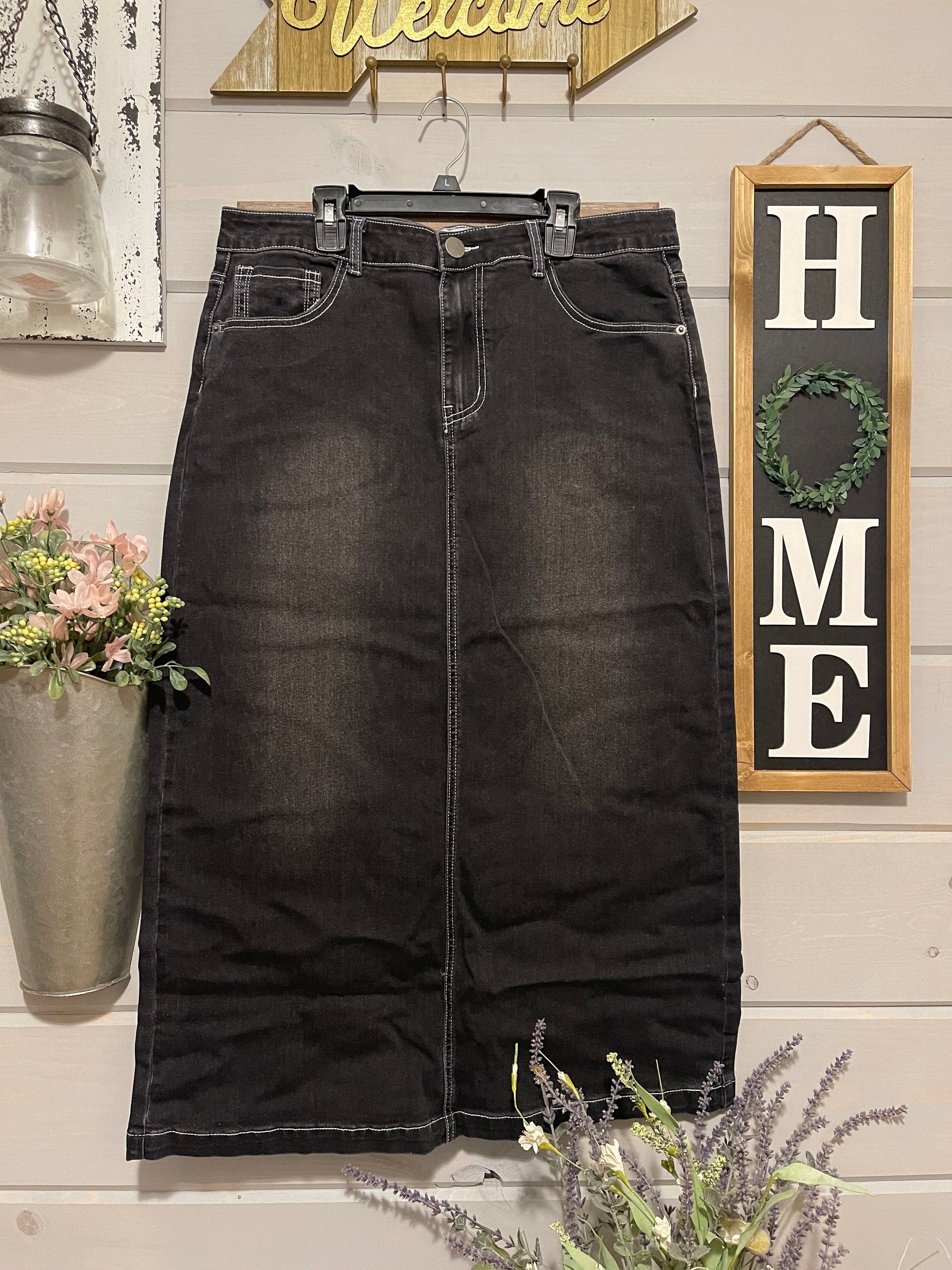 White denim skirt below the cheap knee