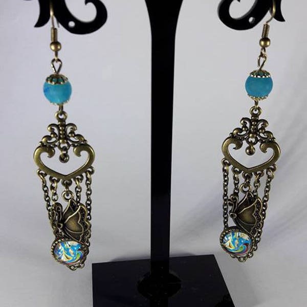 boucles d'oreilles  steampunk bronze avec support cabochon papillon couleur bleutée