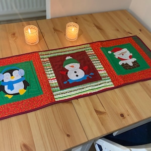 Christmas table runner sewing pattern. Snowman, santa and penguin festive characters. DIY step by step workshop applique PDF