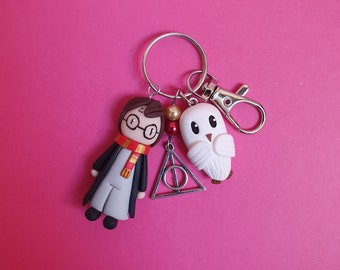 Bijoux de sac harry et hedwige ( breloque relique de la mort)