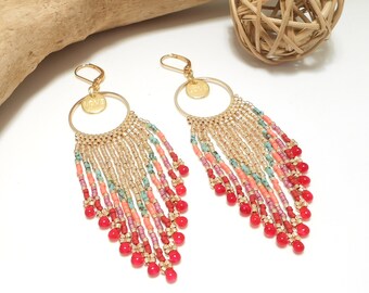 May include: Gold hoop earrings with a "LOVE" charm and a beaded fringe in shades of pink, coral, turquoise, and gold.