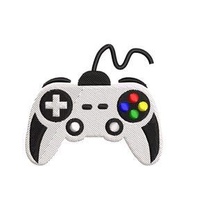 May include: An embroidered design of a white video game controller with black accents. The controller features a directional pad, buttons, and a multi-colored button cluster. The text "Embroidery Design" is below the controller.