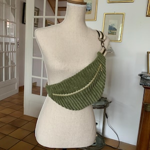 Belt bag/corduroy/green/lined with matching fancy cotton/worn over the shoulder/adjustable/fancy cotton strap/very trendy bag/