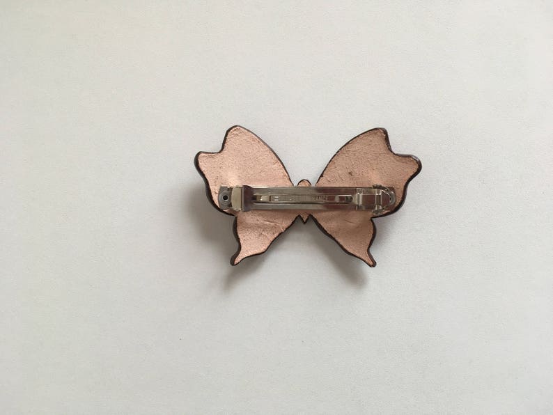 the look of the butterfly pattern Tooled leather hair Barrette