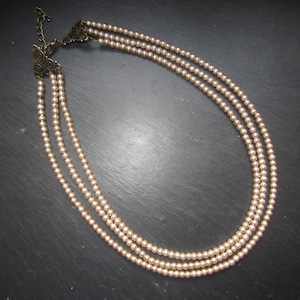 Multi-row necklace in coffee glass beads