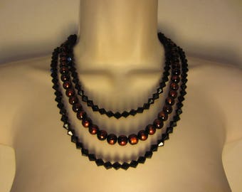 Collier noir et orange multi rangs