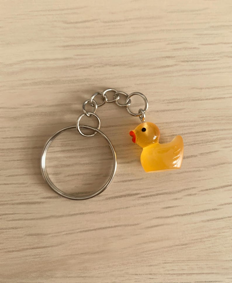 Vintage Retro 1990's Style Pale Orange Black Clear Silver Duck Rubber