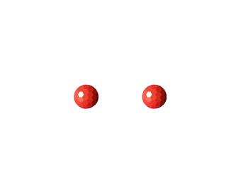 May include: Two red round stud earrings with a textured surface.