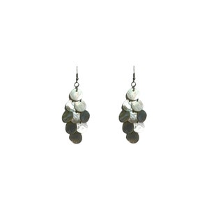 May include: A pair of silver dangle earrings with multiple iridescent round shell-like charms hanging from the bottom.