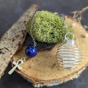 Rock crystal pendulum and lapis lazuli stone divination dowsing
