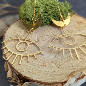 Gold devil eye metal dangling earrings