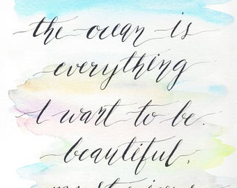 May include: Watercolor painting with a quote in black calligraphy that reads "the ocean is everything I want to be. beautiful. mysterious. wild and free".