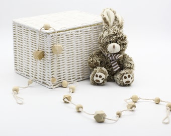 Garland of wooden beads for the baby's room