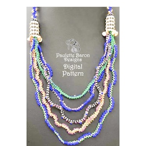 May include: A multi-strand beaded necklace with a blue, green, pink, and black color scheme. The necklace has a unique design with a series of small beads arranged in a wave pattern. The necklace is finished with a pair of decorative bead caps. Paulette Baron Designs Digital Pattern.