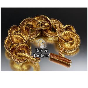 May include: A gold beaded bracelet with a twisted design. The bracelet has a clasp closure.