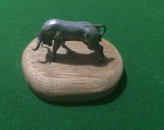Vintage steel Bull on wooden plarc