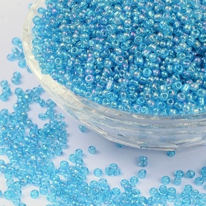 1000 Perline di semi blu traslucide con riflessi multicolori Diametro 2 mm 12/0 - creazione di gioielli
