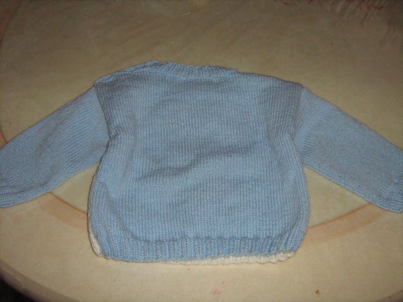 Blue jacquard sweater with hand-knitted 6-year-old tiger