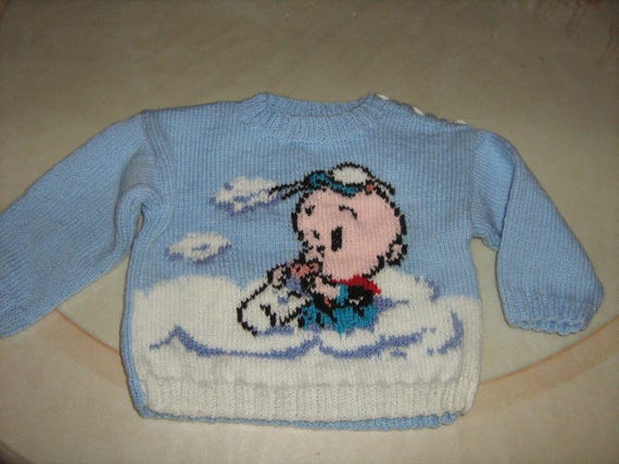 Blue jacquard sweater with hand-knitted 6-year-old tiger