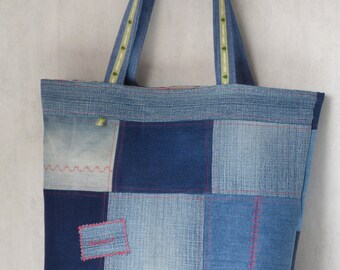 Grote Cabanel van gerecycled blauw patchworkdenim, appels