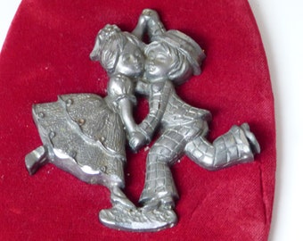 Tin figurine frame of couple of dancing children