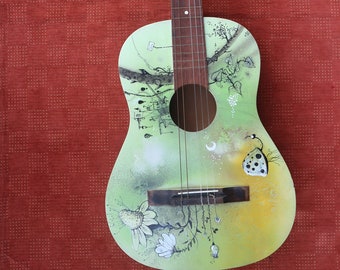 Guitar. Green guitar painted and illustrated. A green Ladybug in the middle of the Green flowers.