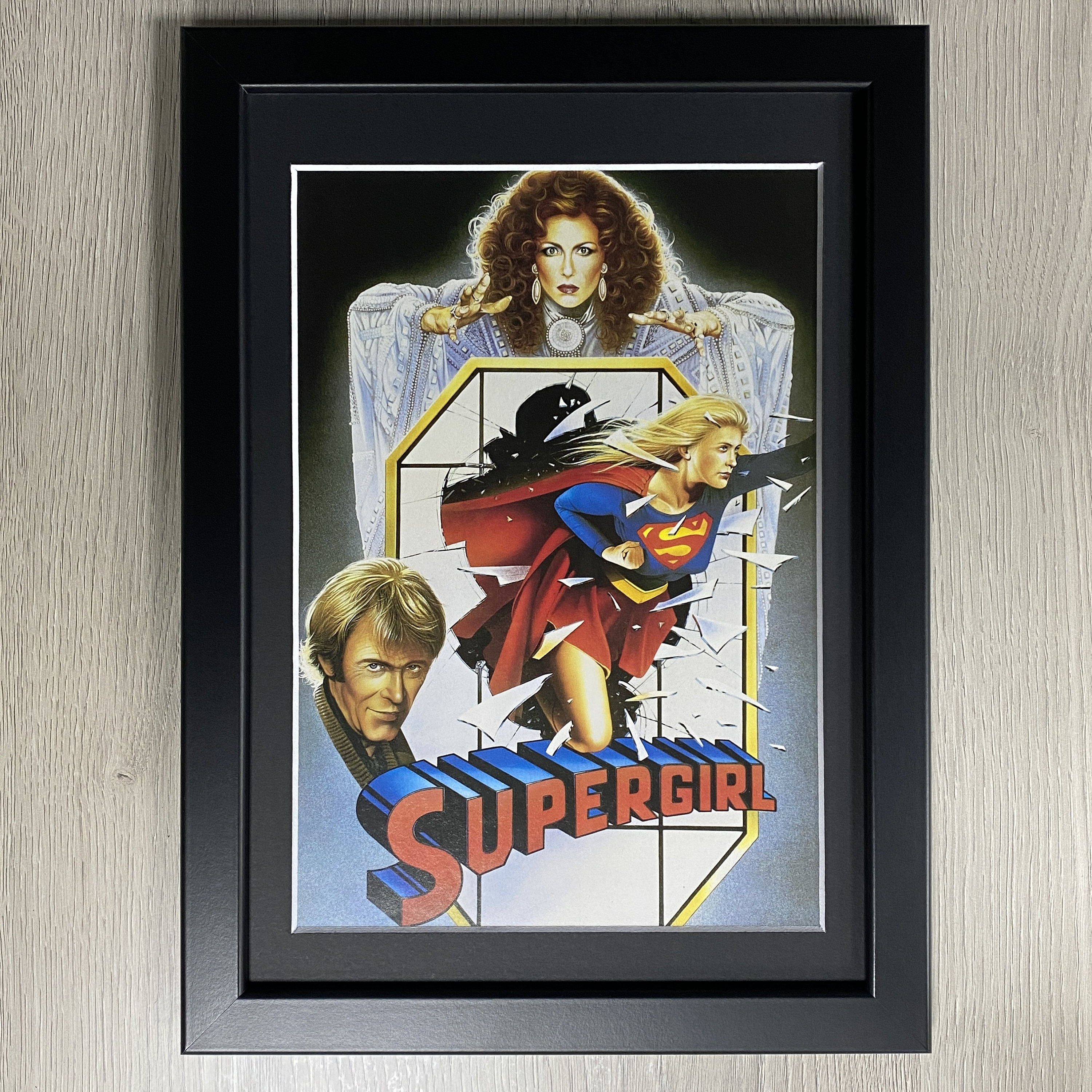 Framed Supergirl 1984 Movie Art, Starring Helen Slater, Faye Dunaway and Peter O'Toole.