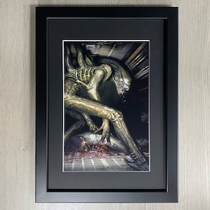 Framed Alien, Movie Art. 1979 Science Fiction Horror Film, Starring Sigourney Weaver and Harry Dean Stanton Directed By Ridley Scot.