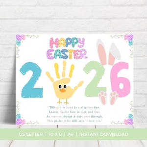 May include: A pastel Easter-themed print with the words "Happy Easter" in colorful letters. The number "2" is light blue, a handprint is a yellow chick, and the number "26" is green and pink. The print includes a poem.