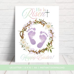 May include: A white Easter-themed print featuring the words "He is Risen" and "Happy Easter!" in elegant script. The design includes a floral wreath, a cross, and two purple footprints. The print is available in US Letter and 8 x 10 inch sizes.