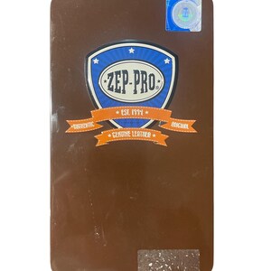 May include: A brown rectangular product with the ZEP-PRO logo in blue and white. The logo is in a shield shape with the words "AUTHENTIC" and "ORIGINAL" on orange banners. The text "EST. 1994" and "GENUINE LEATHER" are also visible.