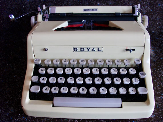 1955 Banana Yellow Royal Quiet Deluxe portable typewriter with case.