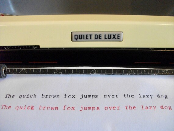 1955 Banana Yellow Royal Quiet Deluxe portable typewriter with case.