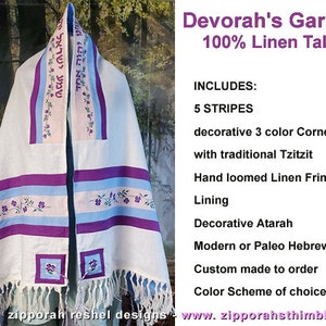 May include: A white linen tallit with purple and blue stripes, decorative corners, and a hand-loomed fringe. The tallit is embroidered with Hebrew text and floral designs. It is labeled "Devorah's Garden 100% Linen Tallit".