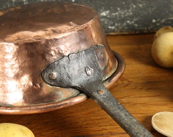 Antique French copper pan with a long wrought iron handle for farmhouse display