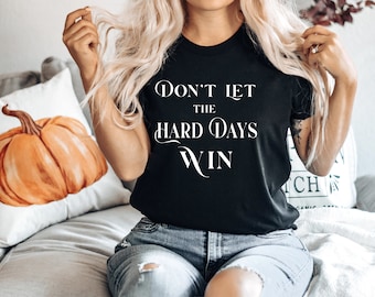 Laat de harde dagen niet winnen Unisex T-Shirt met korte mouwen