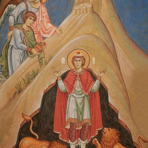 May include: A religious mural depicting a central figure in a red cloak and white tunic, arms outstretched, with a halo. Two lions flank the figure. Two other figures and an angel are in the background. The text "DANIEL IN THE LIONS DEN" is at the top right.