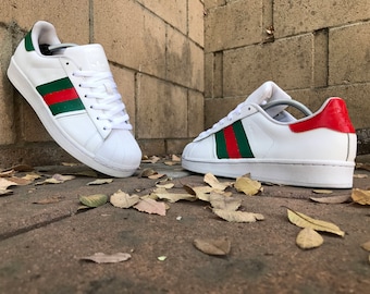 superstar adidas gold and black