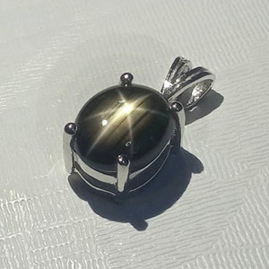 10 x 8 mm. Natural star black sapphire pendant sterling silver.
