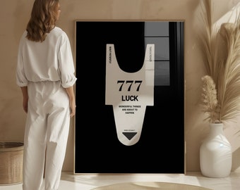 May include: Black and white graphic print of a plastic bag with the text "777 LUCK WONDERFUL THINGS ARE ABOUT TO HAPPEN" on a black background.