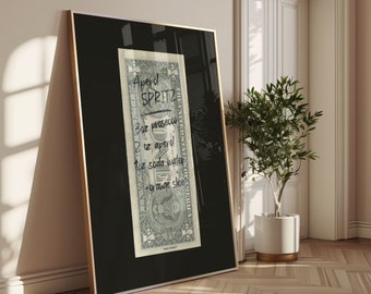 May include: A black framed poster with a US dollar bill inside. The bill has handwritten instructions for making an Aperol Spritz: 3 oz prosecco, 1 oz Aperol, 1 oz soda water, and 1 orange slice.