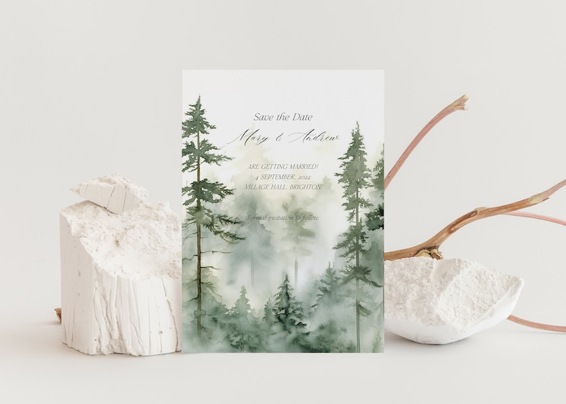 May include: Save the Date card with a watercolor illustration of a misty forest with tall pine trees. The text reads "Save the Date Mary & Andrew Are Getting Married 4 September 2022 Village Hall Brighton Formal Invitations to Follow"