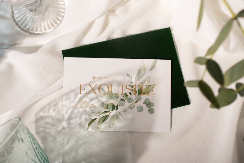May include: A white card with the text "greenery art EXQUISITE" in gold lettering. The card is decorated with a watercolor illustration of green leaves and branches.