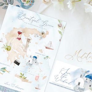 May include: A watercolor illustration of a map of Greece with various icons representing the country, including a glass of wine, a bicycle, a boat, a camera, and a church. The text "Beautiful Greece" and "Our Honeymoon July 2017" is written at the top of the map. The text "Mediterranean Inspired Icons" is written in gold lettering below the map.