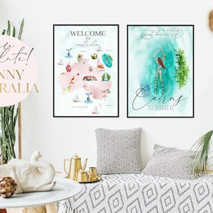 May include: Two framed watercolor prints of Australian landscapes. The first print features a map of Australia with various landmarks and the text "Welcome to Australia". The second print features a watercolor painting of a woman swimming in the ocean with the text "Cairns Summer".