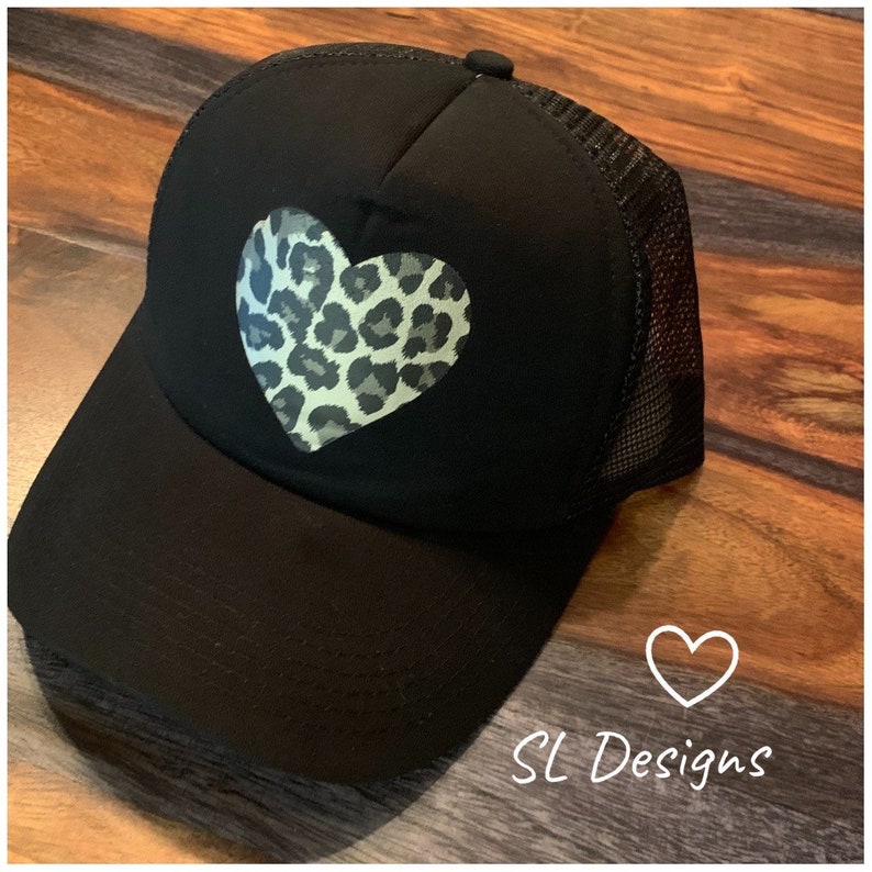 Black trucker hat with leopard print heart